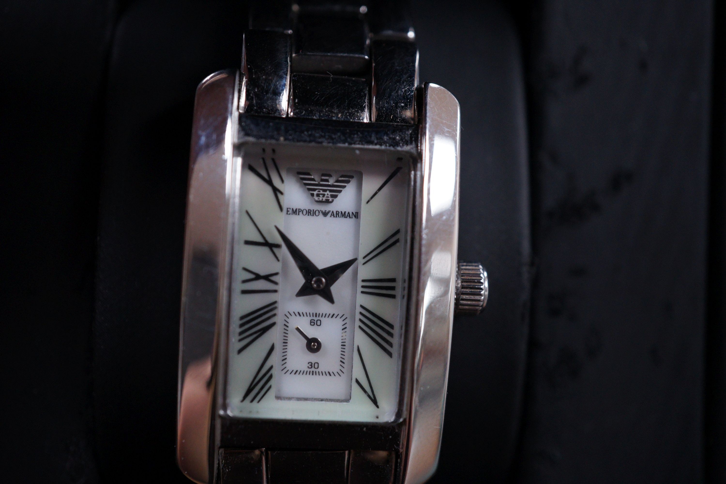 A lady's modern Emporio Armani quartz wrist watch, with mother of pearl dial and box.